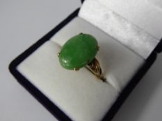 A Lady's 14 ct Jade Stone Cabachon Ring, approx 15 x 11.5 mm, size N, approx 4.4 gms.