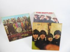 A Collection of Beatles LP Records, including 'Lonely Hearts Club Band', 'Rubber Soul', George