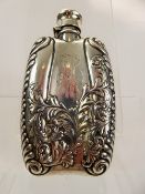 A Silver Hip Flask, stamped sterling, embossed with foliate scroll design, approx 13 x 7 cms, approx