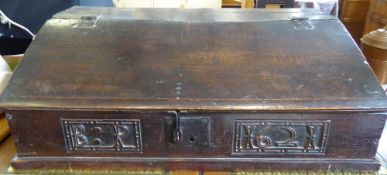 An Antique Stained Oak Bible Box , the box with hinged lid and numbered 1621, with letters BP,