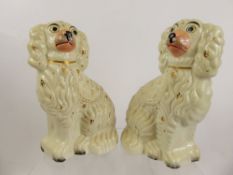 A Pair of 19th Century Staffordshire Spaniels, approx 25 cms
