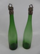 A Pair of 19th Century Green Wine Pourers, with silver grape style tops (corks waf).(2)