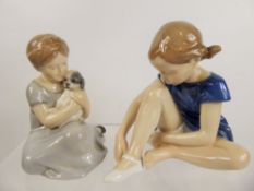 Two Royal Copenhagen Porcelain Figurines, entitled 'Girl Cuddling Puppy' nr 2537, approx 15 x 12