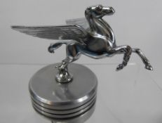 A Chrome-Covered Bonnet Ornament, in the form of a 'Winged Pegasus', mounted on a cylindrical