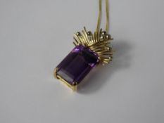 An 18 k Yellow and White Gold Hand-Crafted Bead and Wire Work Amethyst Drop Pendant, the emerald cut