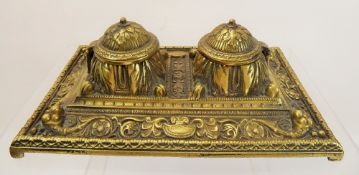 A Brass Ink Stand, the stand having two lidded wells and decorative floral pattern to base, approx