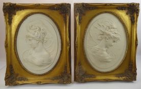 A Pair of Marble Plaques, in high relief of ladies in profile, the verso inset with a medallion