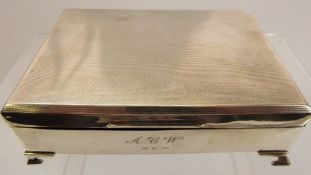 A Silver Double Cigarette Box, cedar lined, Birmingham hallmark, dated 1938-39, supported on ogee