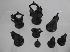 A Set of Eight 19th Century Graduated Burmese Opium/Standard Weights, the weights in the form of the