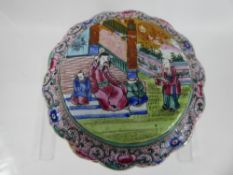 A Chinese Pink Cloisonné Pot and Cover, depicting figures in a garden.