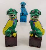 Three Chinese Ceramic Dogs of Fo, two of the dogs have green and turquoise glaze, left paw resting