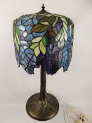 A Tiffany-Style Glass and Lead Table Lamp, depicting wisteria, approx 65 cms.