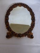 An Oval Gilt wood Mirror of Floral Design, approx 53 x 40 cms.