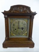 A Edwardian Oak Cased Mantel Clock, with German Badische movement, the clock having a silvered