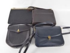 A Collection of Four Vintage Evening Bags, the first black silk taffeta with assayed silver gilt