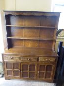 A 'Old Charm'-Style Oak Effect Dresser, the dresser having two plate racks and three drawers with