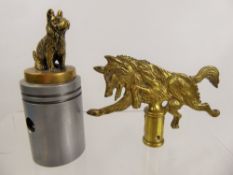 A Brass Bonnet Ornament, depicting a seated terrier, mounted on a cylindrical plinth together with a