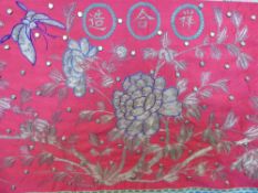 A Large Antique Chinese Silk Wall Frieze, the fuscia silk embroidered with metal thread depicting