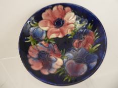 A Moorcroft Bowl, approx 18 cms dia, depicting the pink and blue anemone design.
