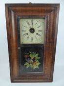 An American Wall Clock, enamel face, Roman dial, with weights and pendulum, approx 57 x 40 cms