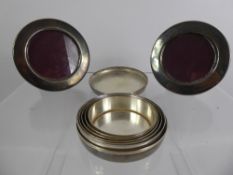 A Pair of Round Silver Plate Photo Frames, approx 9 cms dia, together with a stirrup cup. (3)