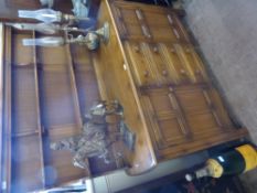 An Ercol Light Oak Dresser, with two plate shelves, four drawers and a cupboard to either side,