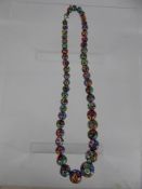 A Millefiori Glass Graduated Beaded Necklace, the largest bead is approx 10.3 mm, approx 40 cms