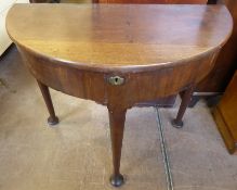 A Mahogany Demi-Lune Table or Writing Desk, the lid opening to reveal writing interior on cabriole