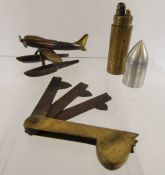 A Trench Art Model of a plane 'Seafire' (wf), together with a cigarette lighter in the form of a