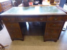 A Walnut Veneer Office Desk, with a tooled green leather top, approx 121 x 62 x 77 cms, four