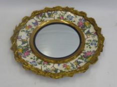 A Decorative Royal Staffordshire Ceramic Plaque, mounted to a circular mirror, painted with garden
