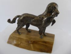 A Model depicting a 'Golden Retriever & Pheasant', on a naturalistic base, approx 24 cms from nose