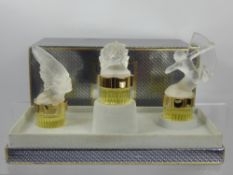 A Trio of Lalique Perfume Bottles, 'Les Mascottes', in the original box.