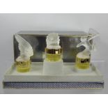 A Trio of Lalique Perfume Bottles, 'Les Mascottes', in the original box.