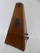 A Mahogany Cased Metronome.