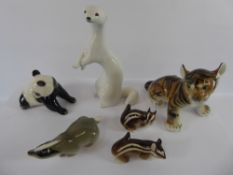 A Collection of Porcelain Animals, including a Tiger, Panda Bear, Badger, Otter and a pair of