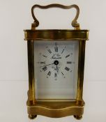 A Brass French Carriage Clock, 'L'Epie Fonde en 1839', white enamel face with Roman dial, approx