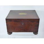 A Regency Mahogany Sewing Box on Bun Feet. The box having a secret drawer with contents.