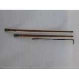 A Child's Silver Banded Riding Cane, together with a silver top cane and one other. (3)