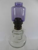 An Art Deco Style Glass Paraffin Lamp, having a stylistic amethyst glass shade, approx 37 cms high.