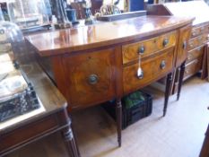 A Regency Style Walnut Sideboard, two central graduated drawers, two cupboards one containing a