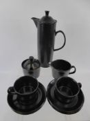 A Black Wedgwood "Eturia" Coffee Set, comprising coffee pot, milk jug, sugar bowl, six cups and