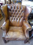 A Georgian Stlye Generously Proportioned Leather Wing Back Chair.