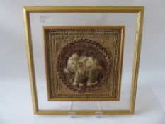 An Indonesian Panel, depicting an elephant, beaded surround with gold and silver cord frame, mounted