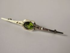 A Lady's Arts & Crafts Silver and Peridot Stick Brooch, the peridot approx 10 x 8 mm, approx 4.7