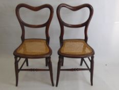 A Pair of Rosewood Balloon Back Bedroom Chairs, together with a mahogany balloon back chair. (3)