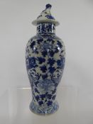 Antique Chinese Blue and White Jar and Cover, hand painted with chasing dragons amongst tree