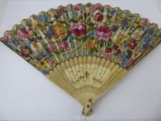 A 19th Century Paper and Ivory Fan, painted with floral sprays to one side and a classical scene