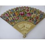 A 19th Century Paper and Ivory Fan, painted with floral sprays to one side and a classical scene