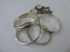 Four Antique Silver Bangles, together with two lady's silver watches and a marcasite brooch